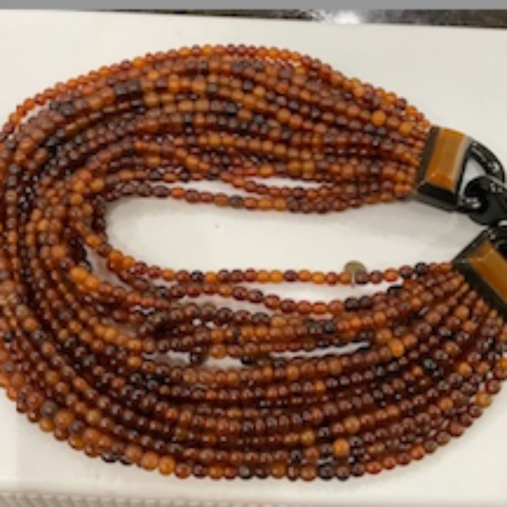 GERDA LYNGGARD MONIES 18 STRAND 21" NECKLACE MADE OF HORN BEADS.